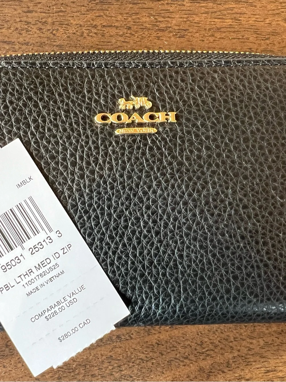 Coach Black Pebbled Leather Zip Around Wallet with Gold Coach Logo